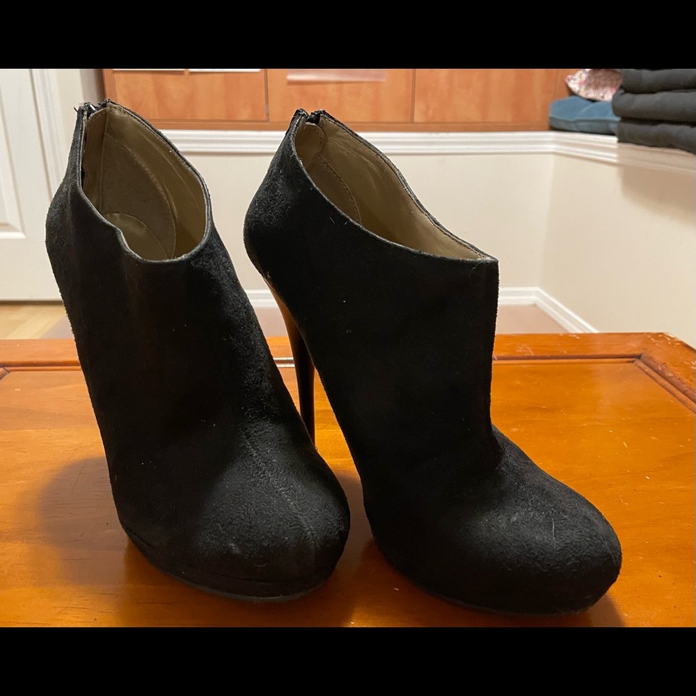 Ridiculously high booties that I can’t believe I teetered around town in.  Fun!